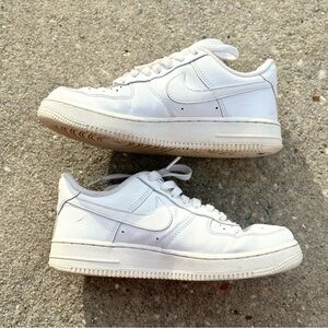 White Nike Air Force ones in really good used condition.